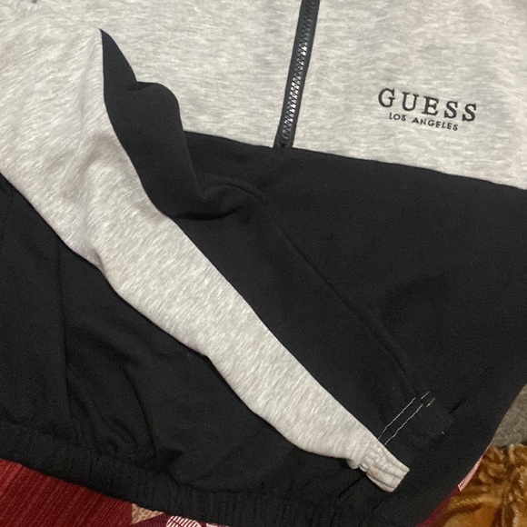 It is a Guess crop top. Black and grey in color. Very comfortable. - Picture 2 of 2